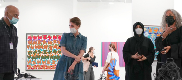 UAE’s cultural and creative industries pulse check, people visiting cultural event. 