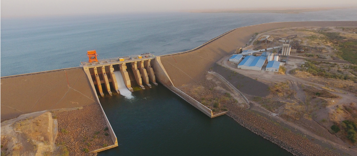 Ariel view of the Dam with water in the middle of desert 