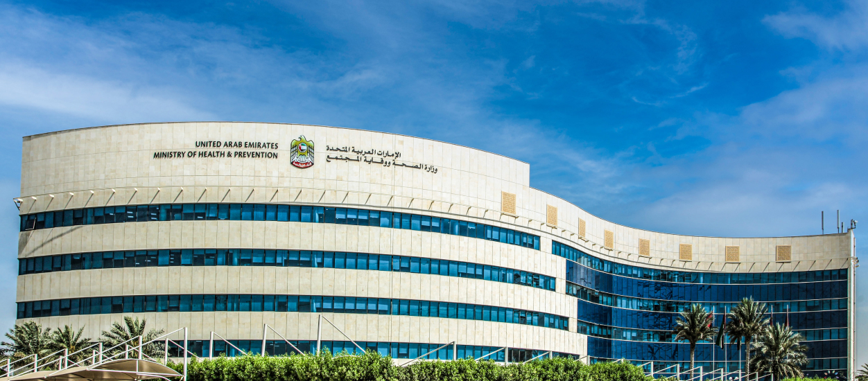 Report on UAE showing a white building in the background